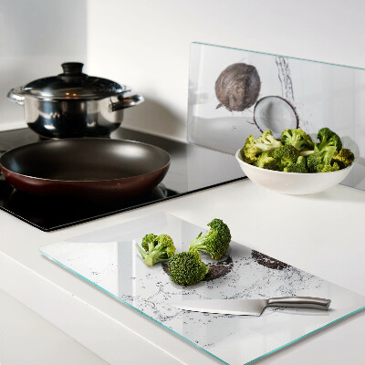 Glass kitchen board Coconuts in water