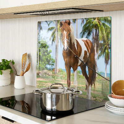 Glass chopping board A horse with palm trees in the background