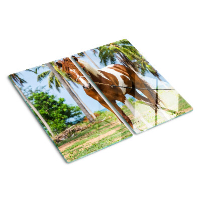 Glass chopping board A horse with palm trees in the background