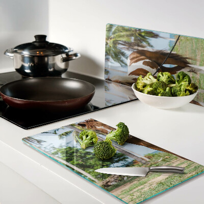 Glass chopping board A horse with palm trees in the background