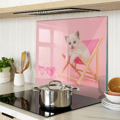 Glass chopping board Kitten on a deckchair on a pink background