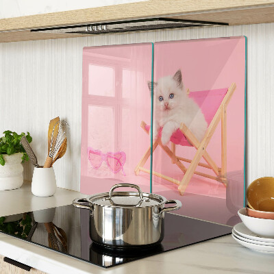 Glass chopping board Kitten on a deckchair on a pink background