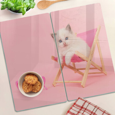 Glass chopping board Kitten on a deckchair on a pink background