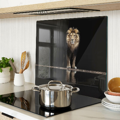 Glass kitchen board Lion on a dark background