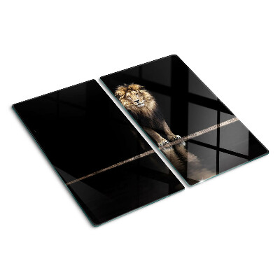 Glass kitchen board Lion on a dark background