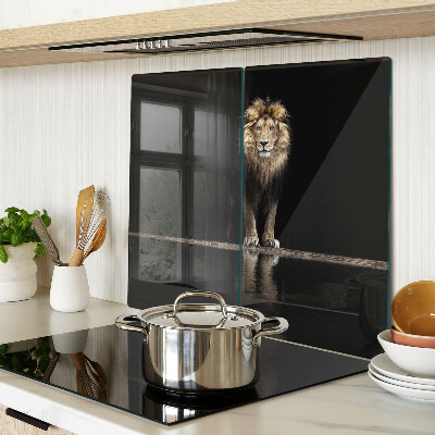 Glass kitchen board Lion on a dark background