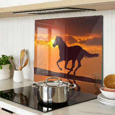 Glass chopping board A horse against the backdrop of the setting sun