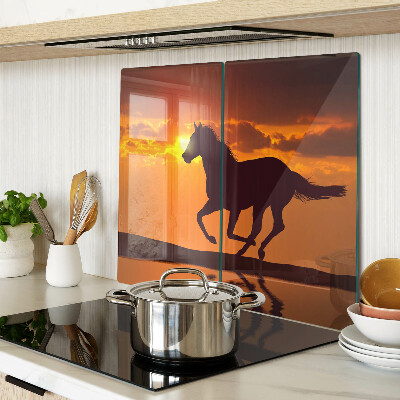 Glass chopping board A horse against the backdrop of the setting sun