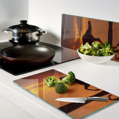 Glass chopping board A horse against the backdrop of the setting sun