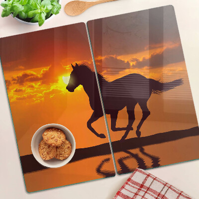 Glass chopping board A horse against the backdrop of the setting sun