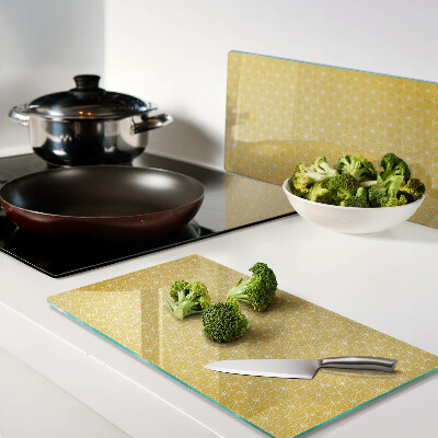 Glass kitchen board Flower of life on a yellow background
