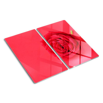 Glass chopping board Red rose on the background