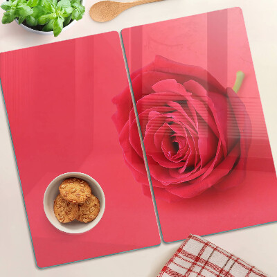 Glass chopping board Red rose on the background