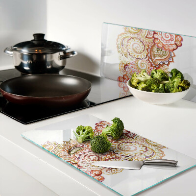 Glass chopping board Paisley motif in shades of red and gold