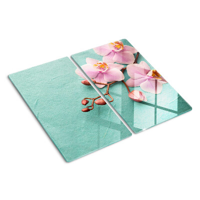 Glass kitchen board Orchids on a blue background