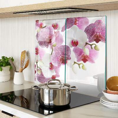 Glass chopping board Orchids in front of the window