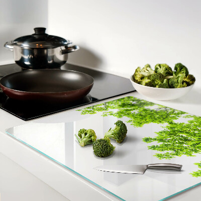 Glass kitchen board Green leaves against the sky