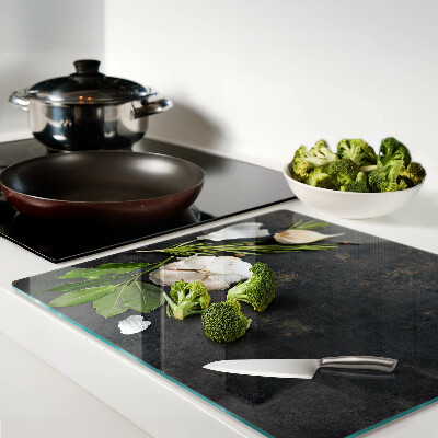 Glass chopping board Flowers and herbs on a marble background