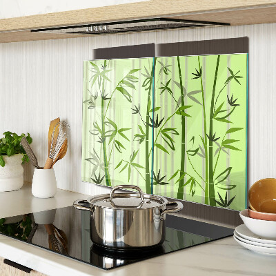 Glass kitchen board Bamboo on green background