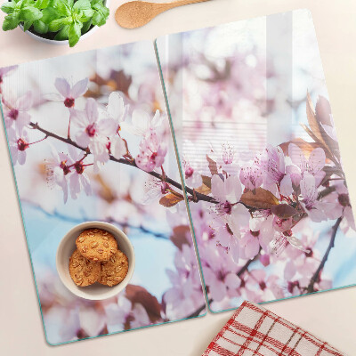 Glass kitchen board Cherry blossoms on a blue background