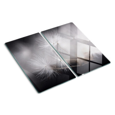 Glass kitchen board Fluffy dandelions against the window background