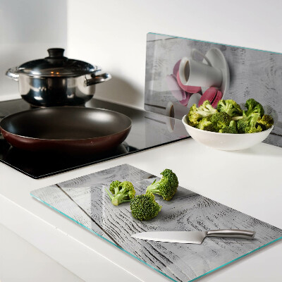 Glass chopping board Coffee and macaroons on a wooden background