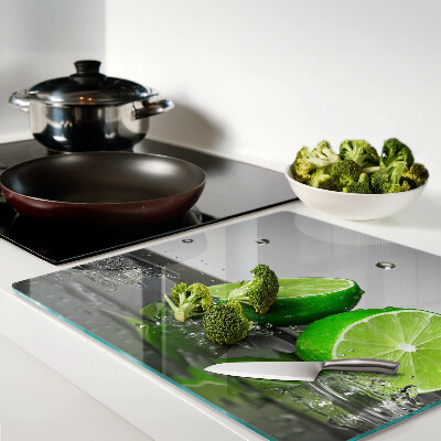Glass kitchen board Lemons in water