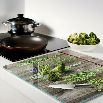 Glass kitchen board Herbs on a wooden background
