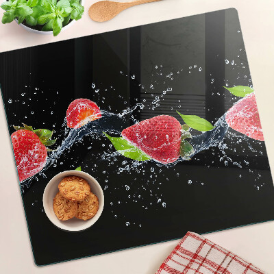 Glass chopping board Strawberries in water