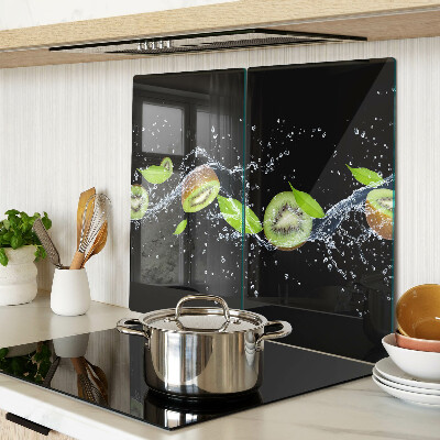 Glass chopping board Kiwi in water with leaves