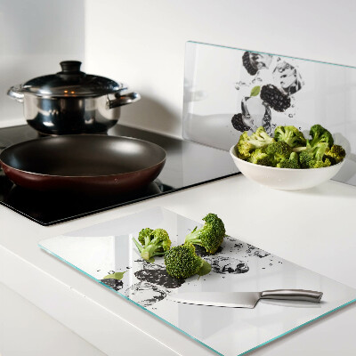 Glass kitchen board Raspberries with leaves and water drops