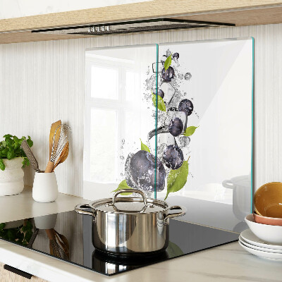 Glass kitchen board Plums in water with leaves