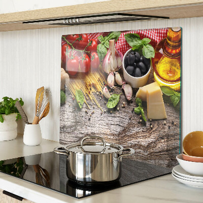 Glass chopping board Italian cuisine with pasta and vegetables