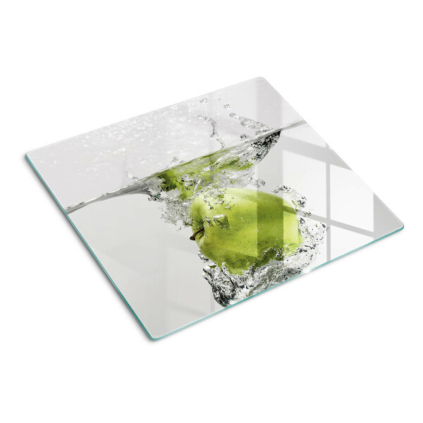 Glass chopping board Green apple in water