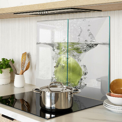 Glass chopping board Green apple in water