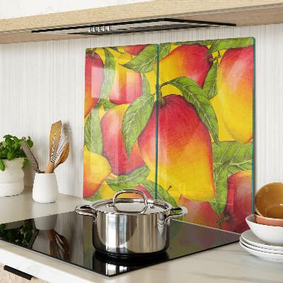 Glass chopping board Peppers on a background of green leaves