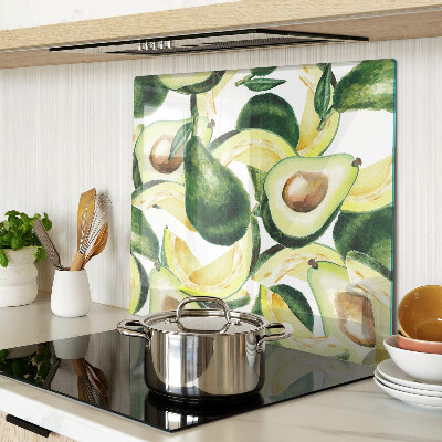 Glass kitchen board Avocado on a background of leaves
