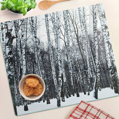 Glass kitchen board Winter forest with birches