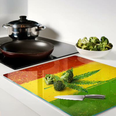Glass kitchen board Hemp leaf on a colored background