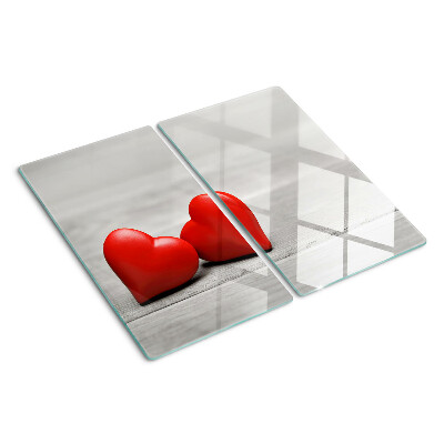Glass chopping board Red hearts on a wooden background