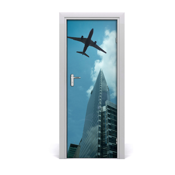 Self-adhesive door wallpaper Plane over the city