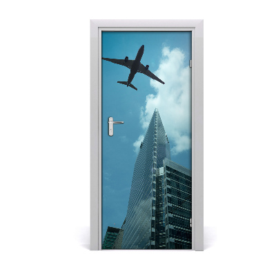 Self-adhesive door wallpaper Plane over the city