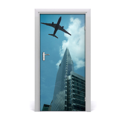 Self-adhesive door wallpaper Plane over the city