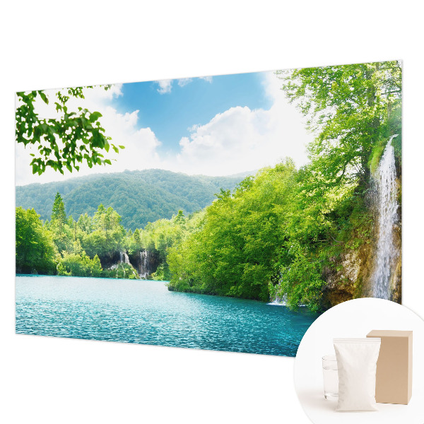 Large wallpaper mural featuring a natural waterfall scene