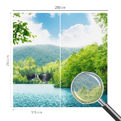 Large wallpaper mural featuring a natural waterfall scene