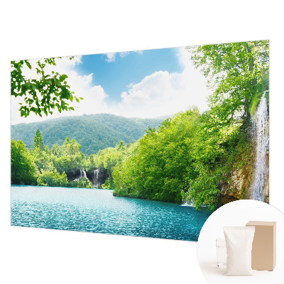 Large wallpaper mural featuring a natural waterfall scene