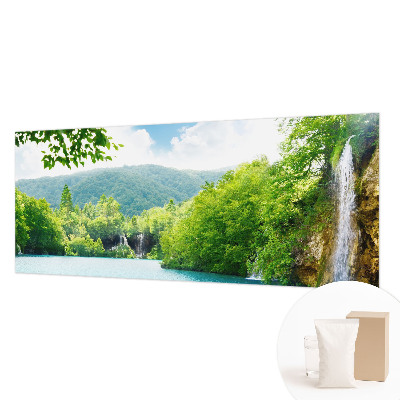 Large wallpaper mural featuring a natural waterfall scene