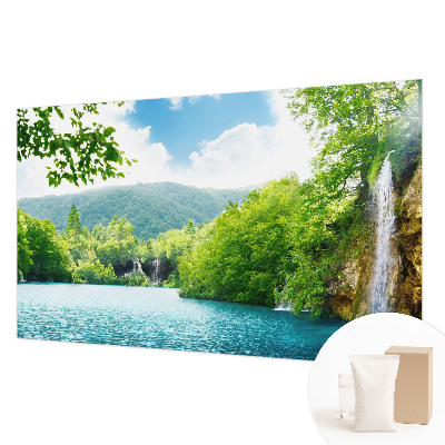 Large wallpaper mural featuring a natural waterfall scene