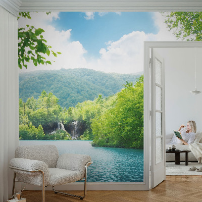 Large wallpaper mural featuring a natural waterfall scene