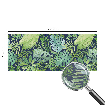 Premium photo wallpaper with a tropical leaves design